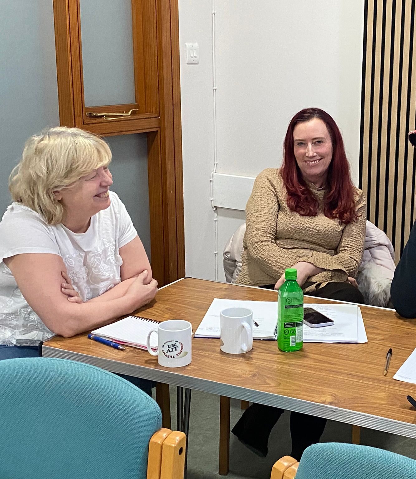 Students having a discussion at UK Therapy Guild's Clinical Hypnotherapy and Integrative Counselling training session.