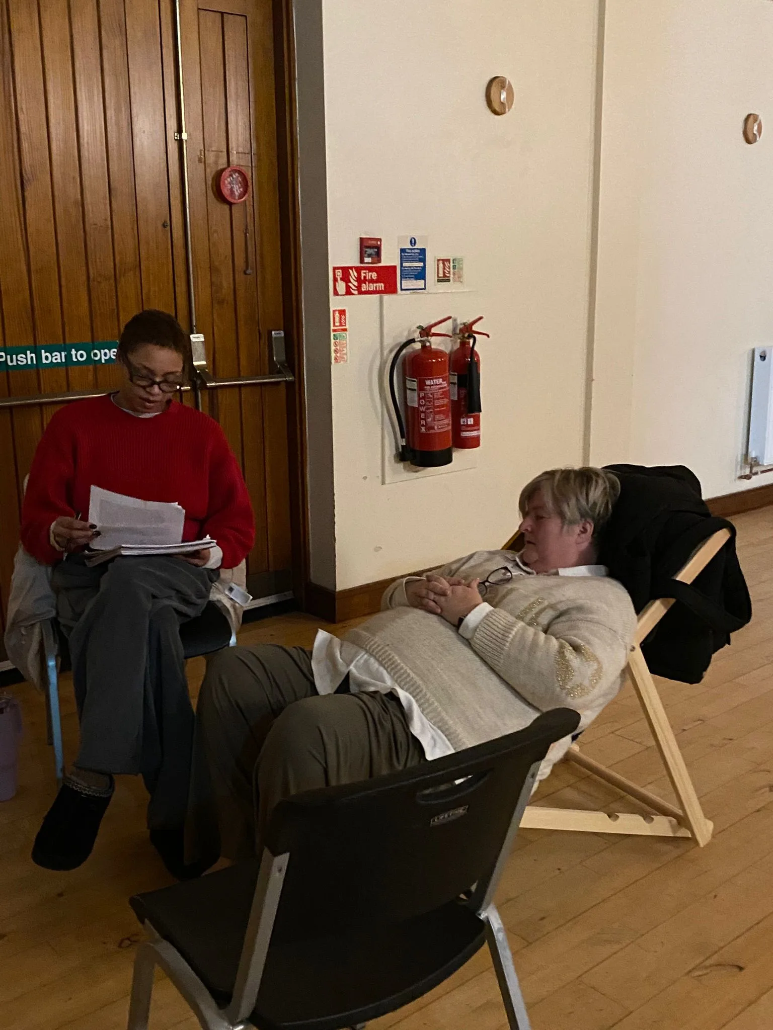 Students practicing hypnotherapy techniques at Liverpool's UK Therapy Guild training center.