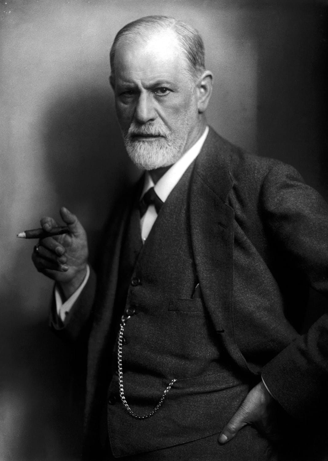 Sigmund Freud: The Father of Psychoanalysis 1 Older bearded man in suit holding a cigar, vintage portrait used for counselling training and therapy courses in Liverpool