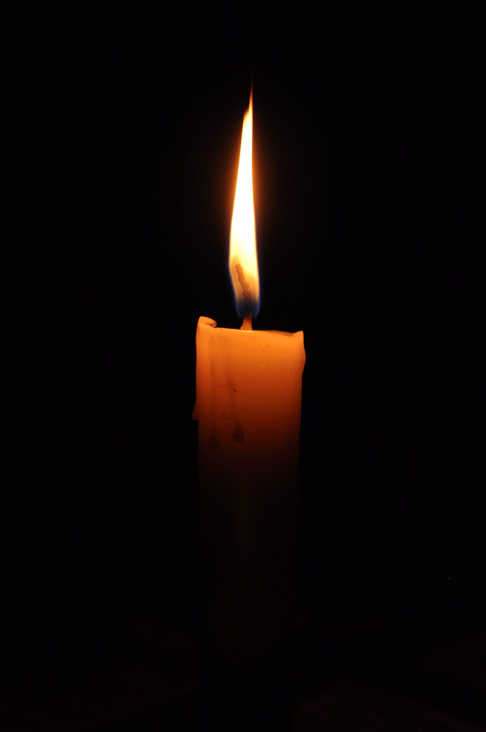 Lit candle flame symbolising calm and focus for counselling and hypnotherapy training in Liverpool