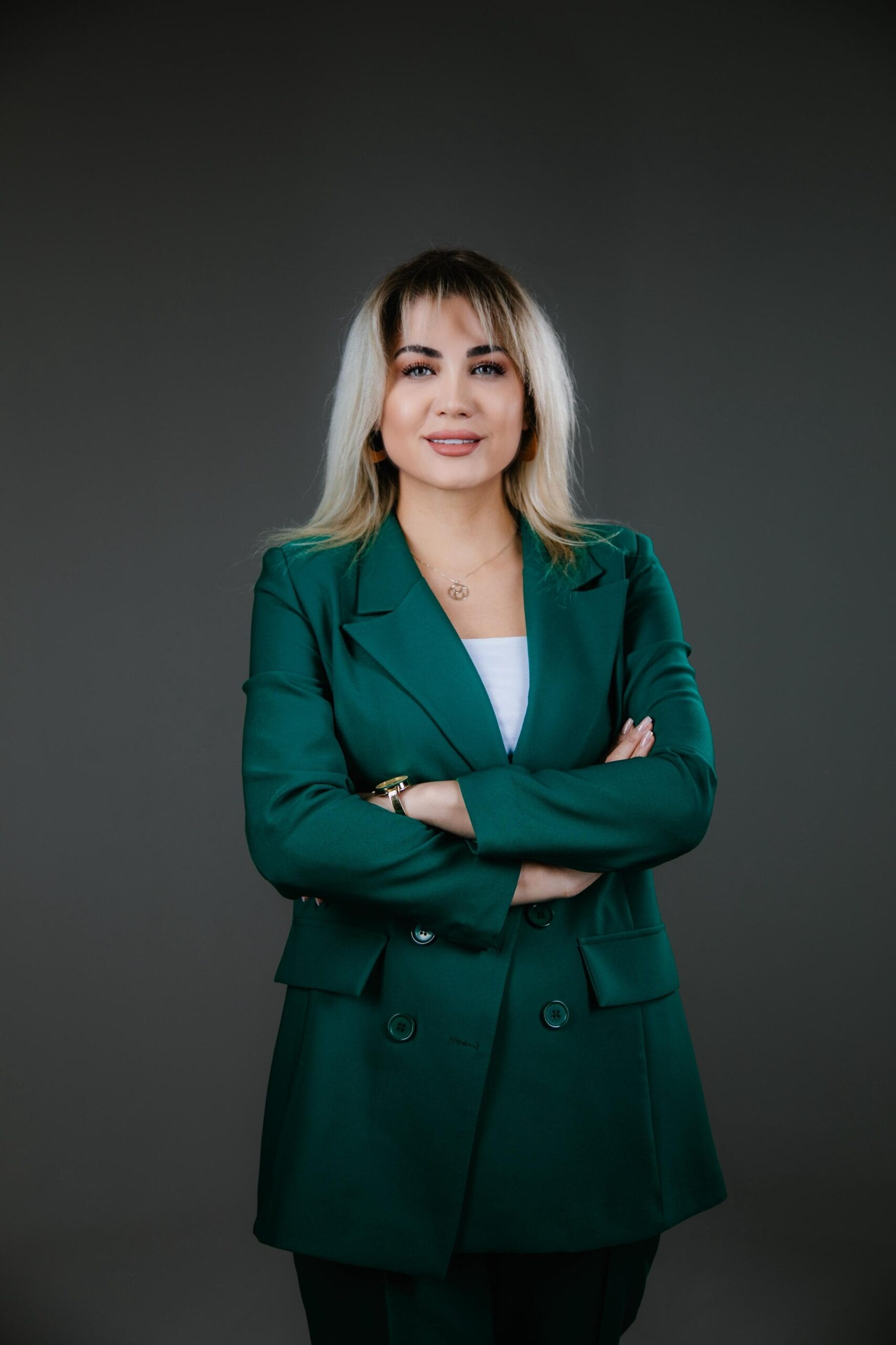 Session Structure in Clinical Hypnotherapy: From Intake to Closing 2 Counselling tutor in green blazer with arms crossed, professional headshot for Liverpool counselling training and CPD