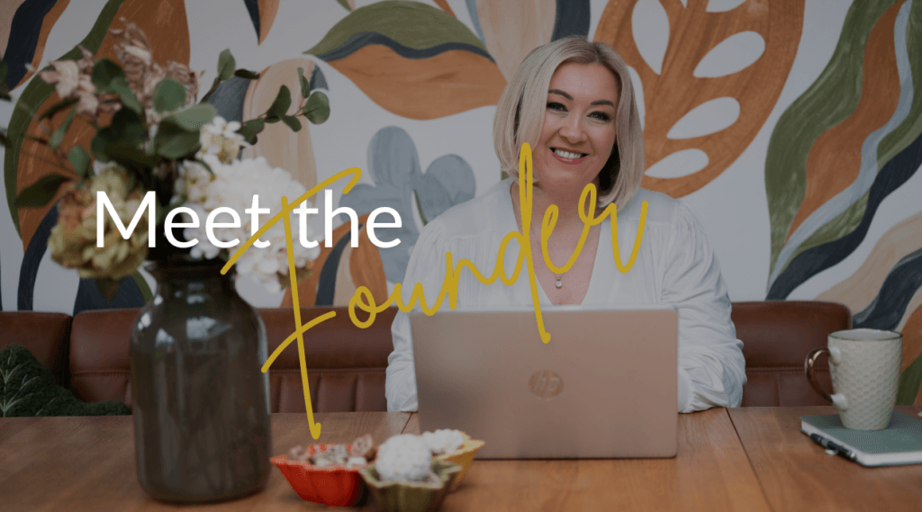 Smiling female tutor at laptop with floral vase and leaf mural, for counselling training and therapy courses in Liverpool
